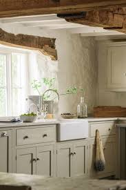 Floral and plant arrangements are used to bring color and texture to the kitchens. Rustic English Country Kitchen Design Inspiration Hello Lovely