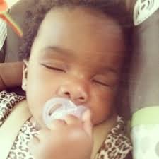 Holding her pacifier in lol.