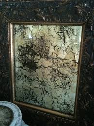 Antiquing the mirror itself with acid, bleach or paint. 10 Tutorials On How To Antique A Mirror So Much Better With Age Antique Mirror Diy Antiquing A Mirror Diy Mirror