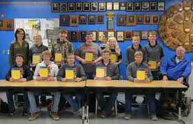 Farm Credit Services of America provides FFA student handbooks to  Hitchcock-Tulare students