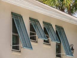 Our simple diy shutter kits give you everything you need to assemble and install your own top quality hardwood shutters at half the price of professional installation. What Are Bahama Shutters Pros Cons Cost And More Home Stratosphere