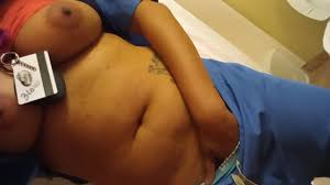 Horny ebony nurse cums