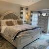 Upholstered headboard with button tufted accents. 1