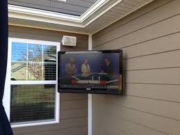 Consider placing your tv in a cabinet to protect it and. Outdoor Flatscreen Tv Installation Charlotte Home Theater Installation Projector Surround Wiring Tv Mo Home Theater Installation Home Theater Setup Patio Tv