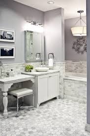 Classic marble tile contrasts with a pure white porcelain freestanding tub, while dark gray curtains and silver accent table give depth and richness. Marble Tile For Bathroom Floor Novocom Top