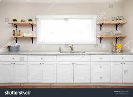 white kitchen cabinets granite