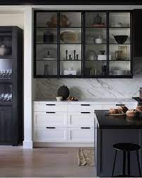 This kitchen features moda cabinet doors with vertical grain, which gives this kitchen its sleek minimalistic design. Black And White Kitchen Black And Glass Cabinet Doors Kitchen Interior Kitchen Design Modern Kitchen