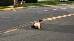 Driver Helps Rescue Baby Crawling Across Road