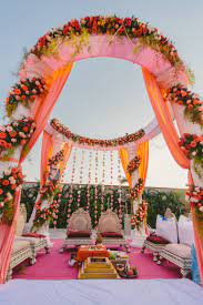 An Outdoor Mandap Setup Orange And Pink Desi Wedding Decor Wedding Mandap Mandap Decor