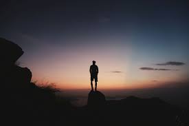 Sad little boy sitting on a stump. Rear View Of Silhouette Man Standing On Cliff Against Sky During Sunset Silhouette Man Sunset Pictures Sunset Photography