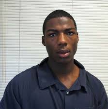 Court says teen to be tried as juvenile in guard's death