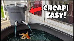 The main pond is about 1100 gallons and there is a smaller pond, about 100 gallons about 25 feet my first inclination was to build a frame to hold the pvc tubes where the plants would receive pond water. Diy Pond Filter Made Easy From Trash Can Youtube