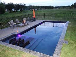 Pool waterfalls have been popular additions to pools large and superb pool waterfall idea! 25 Stunning Rectangle Inground Pool Design Ideas With Sun Shelf Inground Pool Designs Rectangular Pool Inground Pool Landscaping