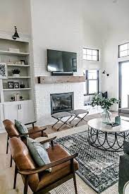 First of all, let me share a pic of our fireplace when we first moved in. Modern Farmhouse Brick Fireplace The Painted Brick Fireplace Is The Focal Point Of The Family Room Warmth Was Introduced Into The Space With The Addition Of A Custom 2 Making Joy And Pretty Things