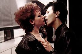 The first time is when bowie goes into his coffin and she is in mourning (she's wearing a veil while she plays and tears are streaming. When Susan Sarandon And Catherine Deneuve Played Vampire Lovers Another
