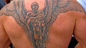 She stands upon the upper arm, her head encircled by a burst of white heavenly light. Angel Tattoo Meanings And Designs Tatring