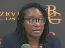 Woman files lawsuit after charges dropped against her and son in fatal  shooting