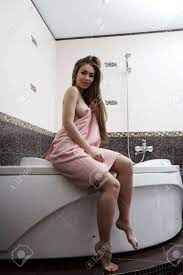 Seductive Woman Bares Her Breast While Sitting On Bath Stock Photo, Picture  and Royalty Free Image. Image 49743342.