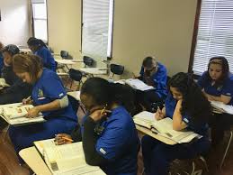 Home Health Aide Student S Acting Studious In The Classroom Hha Textbooks Hardworking Blueuniforms Home Health Aide Vocational School South Plainfield