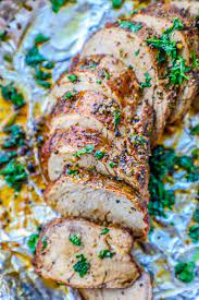 Wrap pork with bacon slices, and secure with wooden picks. The Best Baked Garlic Pork Tenderloin Recipe Ever