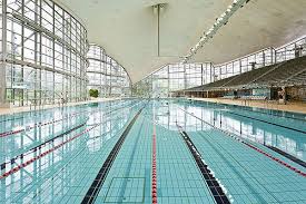 Swimming fans are going to have days filled with their favorite sport. Olympia Schwimmhalle Munich Olympic Pool Swam Here When I Was Younger Swimming Pictures Swimming Photography Swimming Motivation