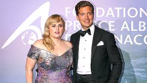 The pitch perfect star is celebrating her progress by jokingly. Rebel Wilson Floats In Strapless Swimsuit While Pdaing With New Boyfriend Jacob Busch Cute Video The State