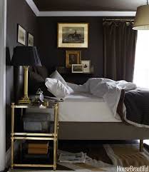 The bed is hollywood style and lacks a headboard however, the pillows fill in the gap and provide plenty of amazing background decor beneath the classic modern artwork that hangs overhead. Decorating With Moody Colors Bedroom Design Home Beautiful Bedrooms