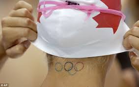 Phelps holds the record for the most gold medals at a single olympics, with his eight at the 2008 beijing games surpassing american swimmer mark spitz's seven gold performance at munich in 1972. Olympic Tattoo Michael Phelps Ryan Lochte And Swimmer Elizabeth Beisel Each Sport The Logo Daily Mail Online