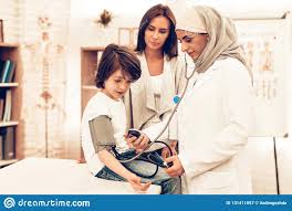 Arabic Female Doctor Checking Blood Pressure Boy Stock Image