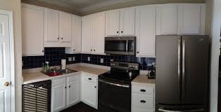 Refresh pickled wood cabinets by doing a deep clean on your existing cabinets. Super White Kitchen Update 2 Cabinet Girls