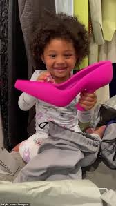 Kylie jenner took to instagram to share a brand new adorable pic of her daughter stormi happily posing in a bathtub while showing off her gorgeous curly hair. Kylie Jenner S Daughter Stormi Three Opens Up A Package Containing Her Mom S Pink Balenciaga Heels Latest Celebrity News