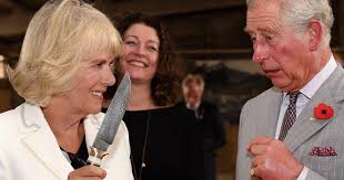 Camilla jokingly waves knife at Prince Charles during Australia tour