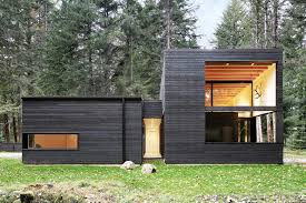 The first floor of the house was painted using distemper paint, but after only four years it was brown instead of black. Courtyard House On A River Robert Hutchison Architecture Archdaily