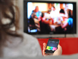 Using A Mobile Phone Whilst Watching Tv Ads Actually Increases Brand Awareness Tv Ads Social Tv Mobile Phone