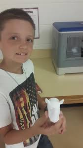 Elementary students Harley Collins, Ryan Chhim, and Pepper Hill working  with our 3D Printer!