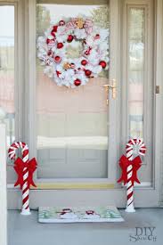 On one side, toiletries are tucked neatly away, while the other is open shelving for displaying pretty decorations. 40 Festive Christmas Door Decoration Ideas Ideas Inspiration