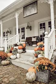 Wrap porch columns with corn stalks, raffia, or even straw. Outdoor Fall Decorating Ideas For Your Front Porch