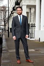 This Guy Looks Like The Woflman Like How The Brown Sets Off The Gray Really Nicely Charcoal Gray Suit Grey Suit Combinations Flannel Suit