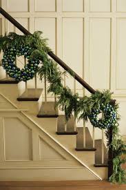 Hang the garland initially by weaving it in and out of the spokes and around the railing of the banister. 30 Gorgeous Christmas Garland Ideas 2019 How To Decorate With Garland