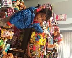 Image of child pointing to a toy