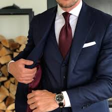 Although the navy tie offers a nice contrast to the white or light blue dress shirt, this is actually not the best choice, as a navy tie will clash with the navy of the suit, looking nearly the same but not exactly so. Spice Up Your Essential Suit A Burgundy Tie With Navy Suit Aklasu