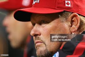 Stubby Clapp of Canada fields as Geronimo Gil of Mexico slides during...  News Photo