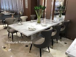 The table is available in two sizes and comes with one extension leaf that can be stored easily in the base. Elise T033 Artificial Marble Dining Table Fortune Furniture