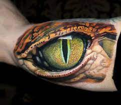 As a form of body painting , temporary tattoos can be drawn, painted, airbrushed, or needled in the same way as permanent tattoos, but with an ink which dissolves in the blood within 6 months. Snake Eye Tattoo By Dave Paulo Post 13165 Tattoos Eye Tattoo Reptile Eye