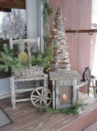 Rustic Christmas Weathered Lantern Basket Of Pine Lighted Grapevine Tree Christmas Decorations Outdoor Christmas Christmas Porch