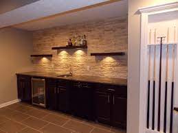 cmh builders wet bar with floating shelves on stacked stone wall basement designs shelf bars for home bracketless