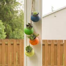 Diy halloween decorations with tin can ghosts. Outdoor Hanging Decor That Adds Playfulness To Any Backyard