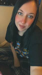 Varsity cheerleaders washing vehicles