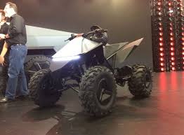 Even in top trim, the cybertruck delivers solid bang the tesla cybertruck promises up to 500 miles of electric range, a maximum tow rating of 14,000 pounds, and a base price under $40,000. Tesla Cyberquad To Be Offered As An Accessory With The Cybertruck Zigwheels