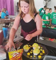 Kids create cupcakes at the fair